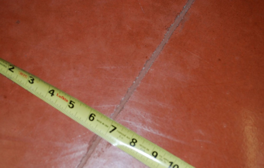 Many people worry steel fibers will show at the floor surface, making the floor look worse. This floor, made with colored concrete and Type II fibers, 25 mm (1 in.) long, shows the steel fibers need not affect appearance.
