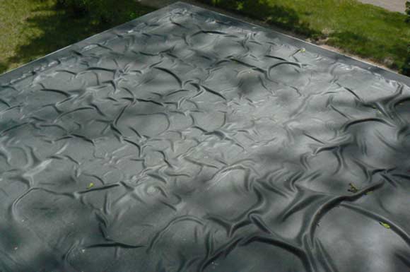 EPDM roof bubbles - what happens when a wrong adhesive is combined with wrong roofing membrane and a wrong installation method.